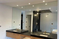 Vanity mirrors with cutouts